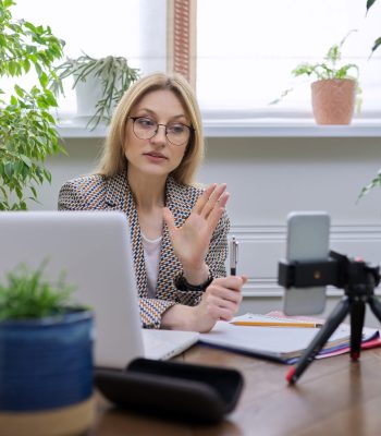 Mature confident business woman working remotely at home Remote & Hybrid Coverage